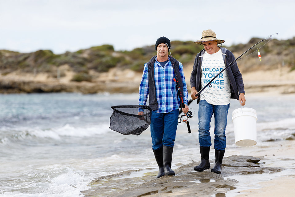 T-Shirt Mockup of Two Fishermen Walking by the Sea