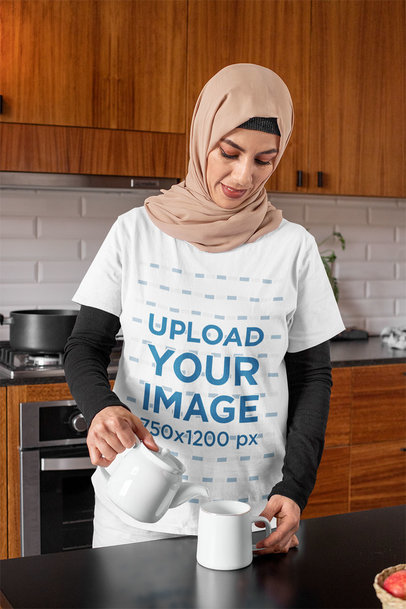 T-Shirt Mockup of a Woman in a Hijab at Home