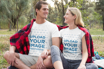 T-Shirt Mockup of a Happy Couple Relaxing in Nature