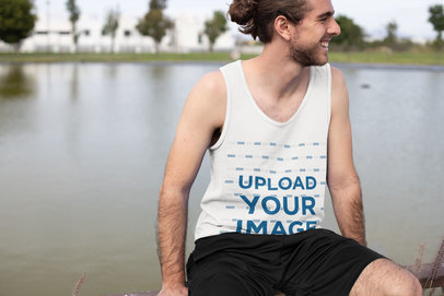 Tank Top Mockup of a Happy Athlete Resting by a Lagoon