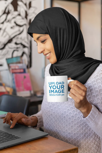 11 oz Coffee Mug Mockup Featuring a Young Woman Working on Her Computer