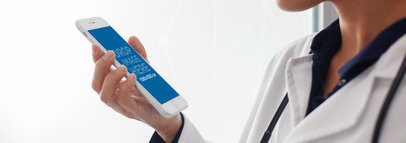 White iPhone 6 Mockup Held by a Doctor