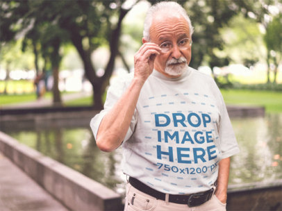 Senior Man Out by the Pond Wearing a Round Neck Tee Mockup