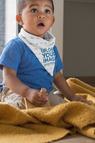 Sublimated Bib Mockup Featuring a Baby Boy Playing with Wooden Toys