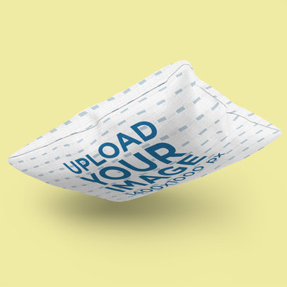 Mockup of a Pillow Falling Into a Solid-Color Surface 3251-el1