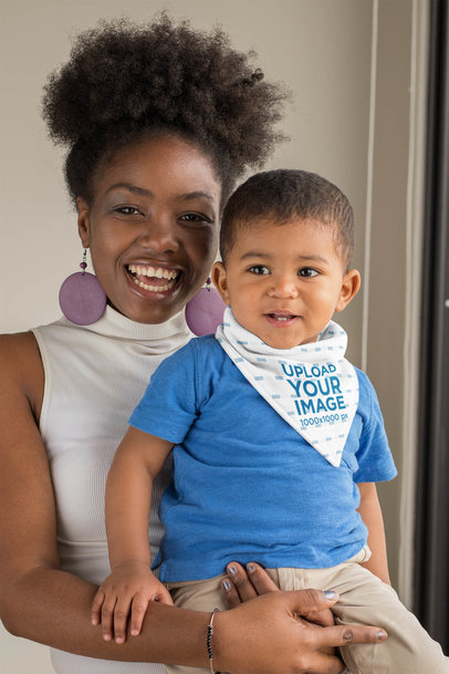 Mockup of a Smiling Mom Holding His Baby with a Sublimated Bib