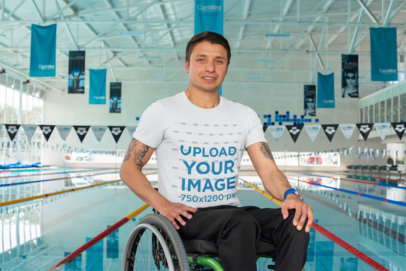 T-Shirt Mockup Featuring a Man at a Swimming Pool 