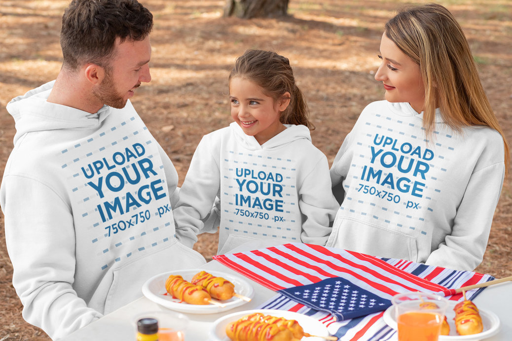 Hoodie Mockup of a Family Eating Together on the 4th of July