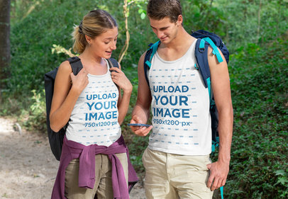 Tank Top Mockup of a Hiker Couple Using a Phone 