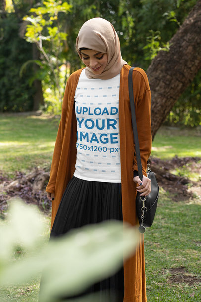 T-Shirt Mockup Featuring a Woman Surrounded by Nature 