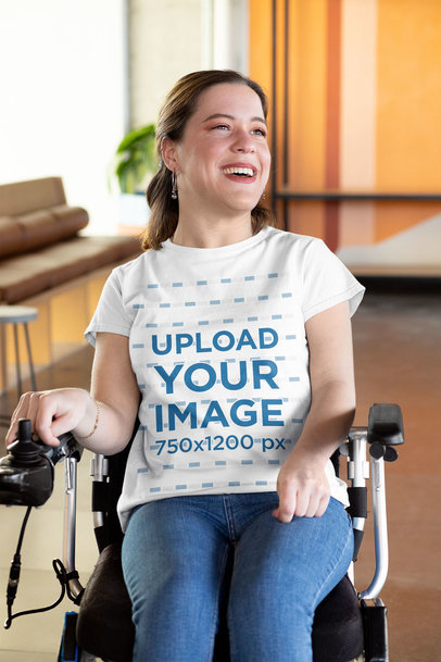 T-Shirt Mockup of a Smiling Woman Using a Wheelchair