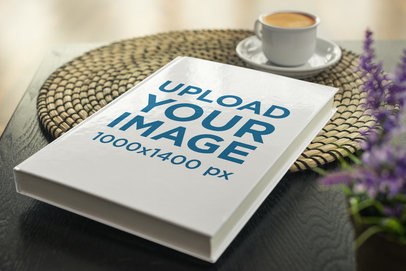 Mockup of a Hard Cover Book Placed on a Coffee Table