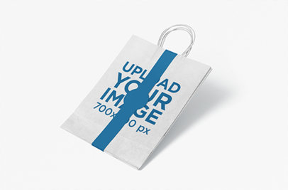 Paper Bag Mockup Featuring a Colored Paper Band and a Plain Background 