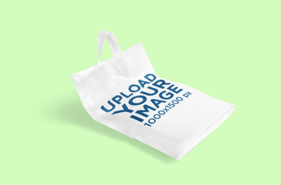 Mockup of a Customizable Plastic Bag Lying on a Plain Color Surface 