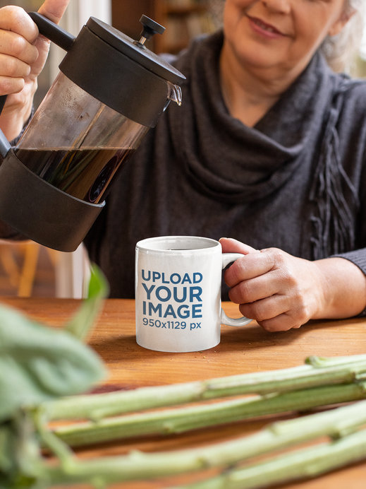 Mockup of a Woman Pouring Coffee Into a Mug at Home