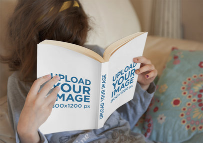 Mockup of a Girl Burying Her Face on a Book
