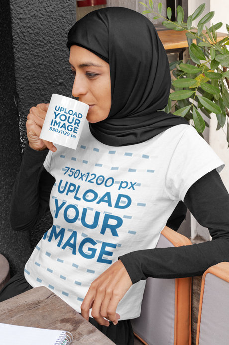 T-Shirt Mockup of a Relaxed Woman with a Hijab Drinking from an 11 oz Mug