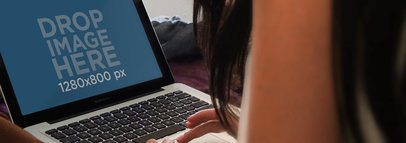 Mockup of a Woman Working on Her MacBook Pro at Home 