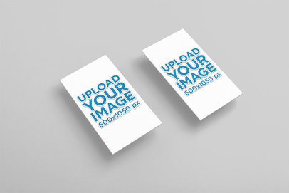 Mockup of Two Embossed Vertical Business Cards Over a Colored Surface