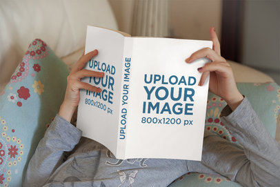 Mockup of a Girl Relaxing with a Book in Her Hands