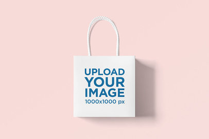 Mockup of a Squared Gift Bag on a Solid-Color Surface