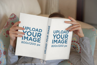 Mockup of a Girl Enjoying the Read of a Book