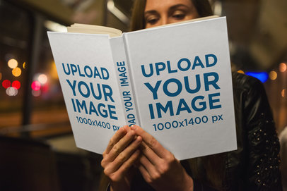 Mockup of a Woman Reading a Hardcover Book at Night 3413-el1