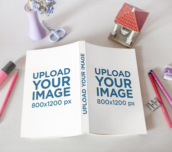 Book Mockup Featuring Some Decorations and Pencils 3451-el1