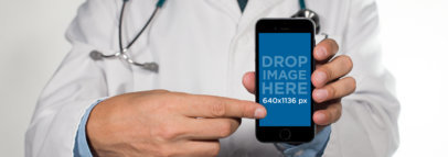 iPhone Mockup of a Doctor Pointing to an iPhone 6 in Frontal View