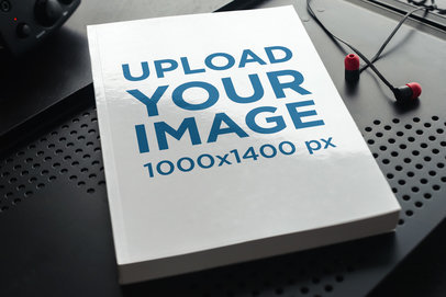 Mockup of a Paperback Book on a Dark-Color Metal Surface 3416-el1