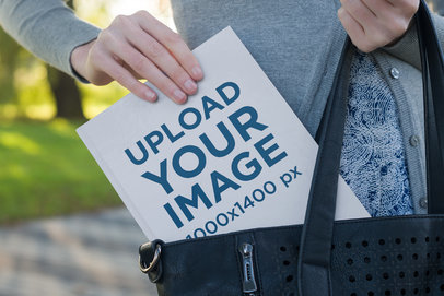 Mockup of a Woman Pulling a Book Out of Her Purse 3420-el1
