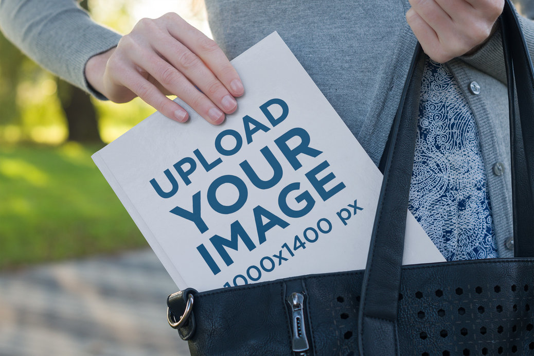 Mockup of a Woman Pulling a Book Out of Her Purse
