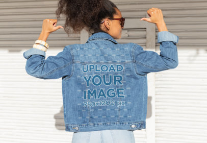 Mockup of a Woman Pointing at Her Denim Jacket 32555