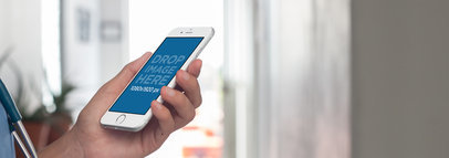 White iPhone 6 Plus Held in Portrait Position by a Medical Doctor a12411