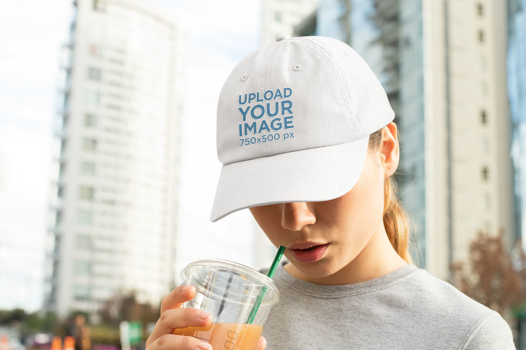 Dad Hat Mockup of a Woman with a Beverage 