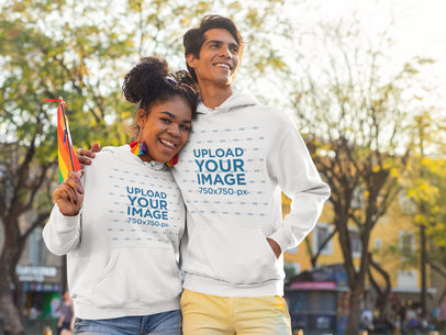 Hoodie Mockup Featuring Two Friends Hugging on the Street 