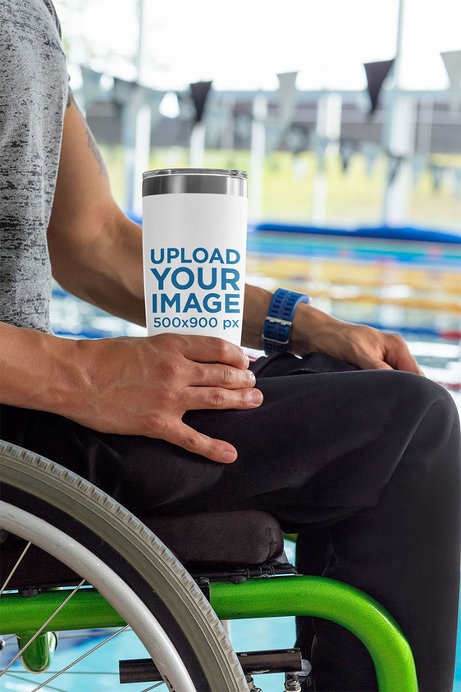 Travel Mug Mockup Featuring a Man Using a Wheelchair by a Pool