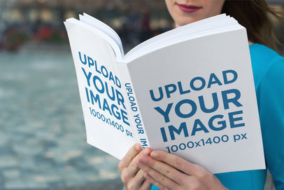Mockup of a Woman Reading a Softcover Book with a Smile on Her Face 3421-el1
