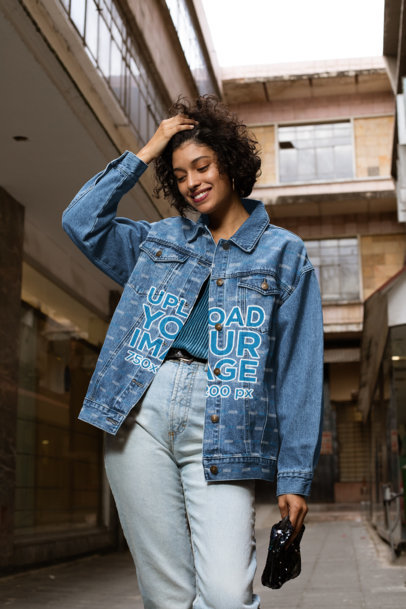 Denim Jacket Mockup Featuring a Smiling Woman Holding Her Hair