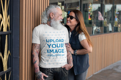 T-Shirt Mockup Featuring a Senior Man with a Cool Beard Talking to His Wife 