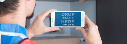 White iPhone in Landscape View Mockup of a Construction Worker