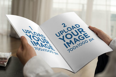 Mockup of a Businessman Holding a Magazine at Home 