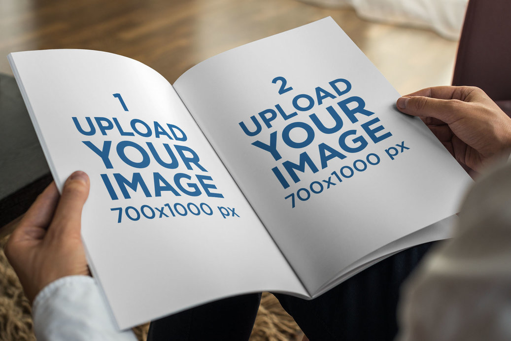 Placeit - Mockup of a Man Holding an Open Magazine