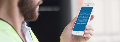 iPhone 6 in Portrait Position Mockup of a Construction Worker