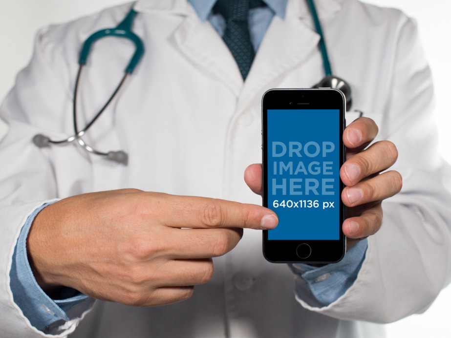 Mockup of a Male Doctor Showing an iPhone in Portrait Mode