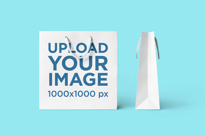 Mockup of a Squared Gift Bag Next to Another One Facing Sideways 3492-el1