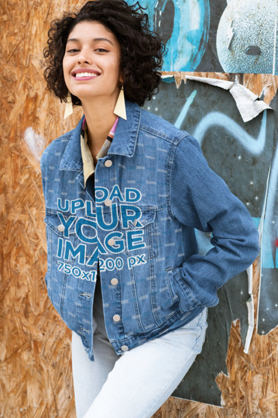 Denim Jacket Mockup of a Woman Posing Against a Wall