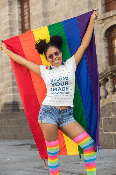 T-Shirt Mockup of a Woman Proudly Holding a Rainbow Flag