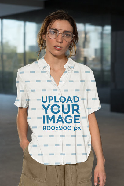 Button-Up Shirt Mockup Featuring a Serious Woman Looking at the Camera