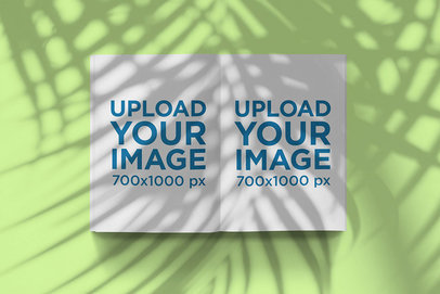Mockup of an Open Magazine Under a Palm Shadow 2462-el1